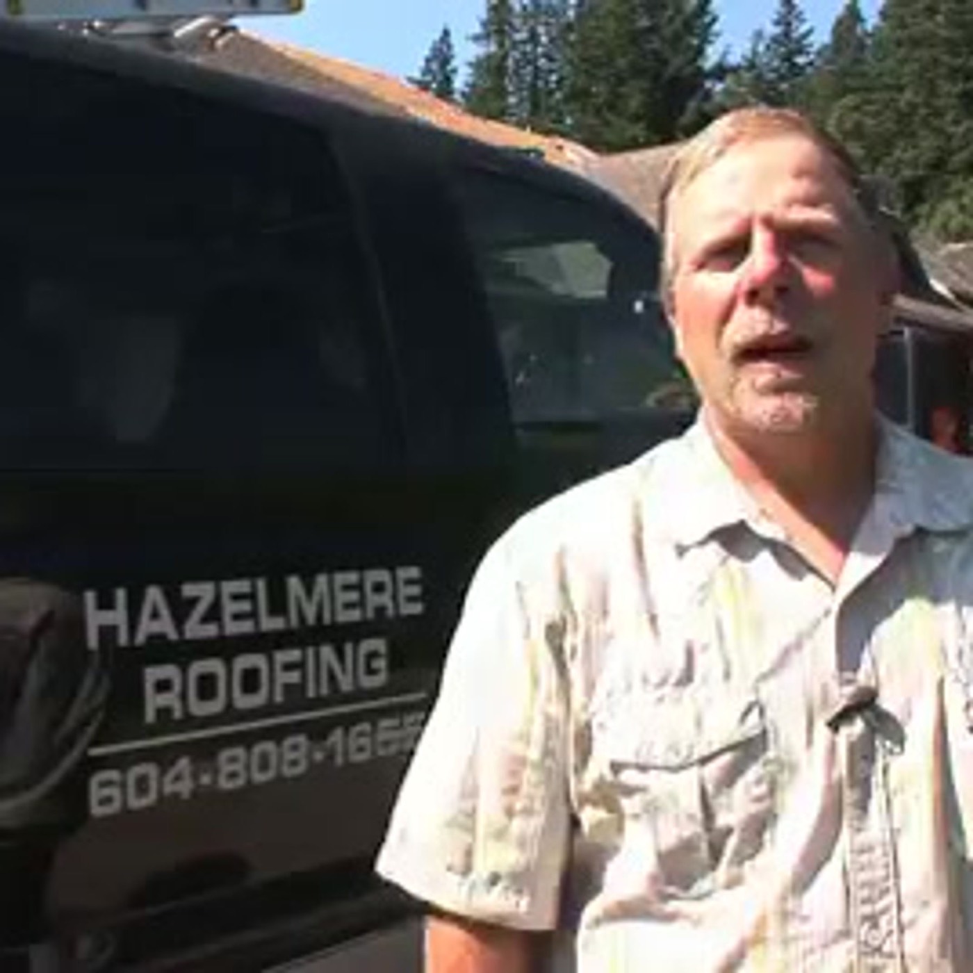 Hazelmere Roofing owner in front of a company truck